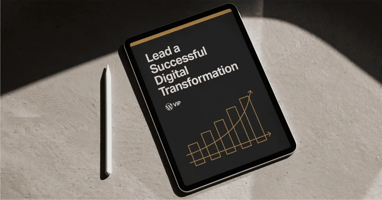 Tablet with Lead a Successful Digital Transformation and a stylus on a concrete surface.
