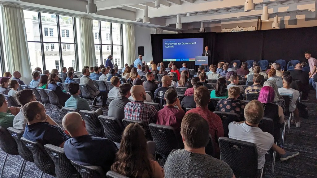 Photo from the back of the room showing audience at "WordPress for Government Summit" presentation