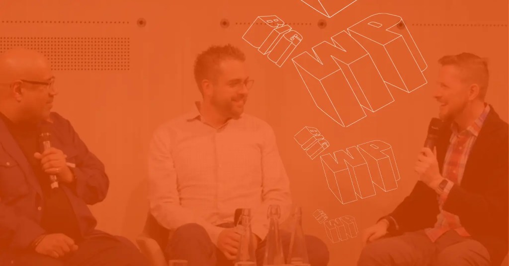 A photo of Matt Mullenweg, co-founder of WordPress and CEO of Automattic, sat down at BigWP London with his co-founder Mike Little, and Dries Buytaert, founder of Drupal and CTO at Acquia, for a discussion about Open Source technology.