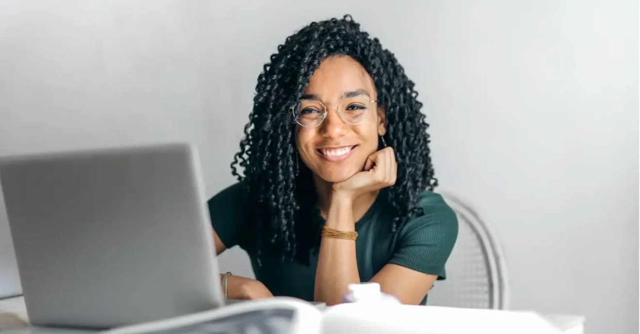 women smiling as she learns about preventing fatal errors on her WordPress site