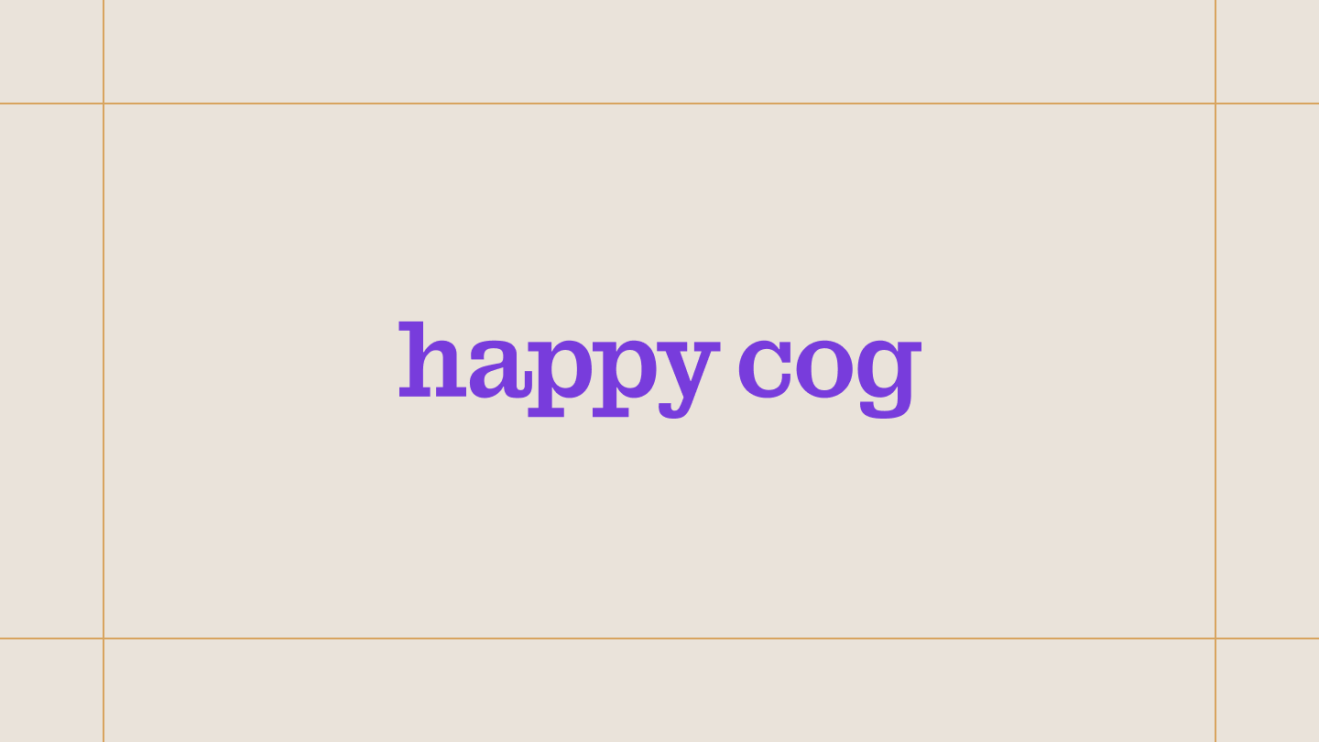 Happy Cog logo on a cream background, framed by thin gold lines.