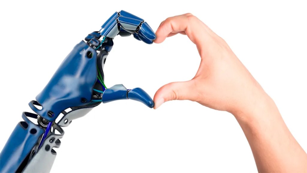 Human and blue robotic hand forming heart shape, symbolizing collaboration in digital solution integration.
