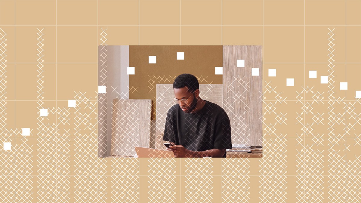 A man looking at a Parse.ly MCP data chart overlaid on his phone in a creative workspace.