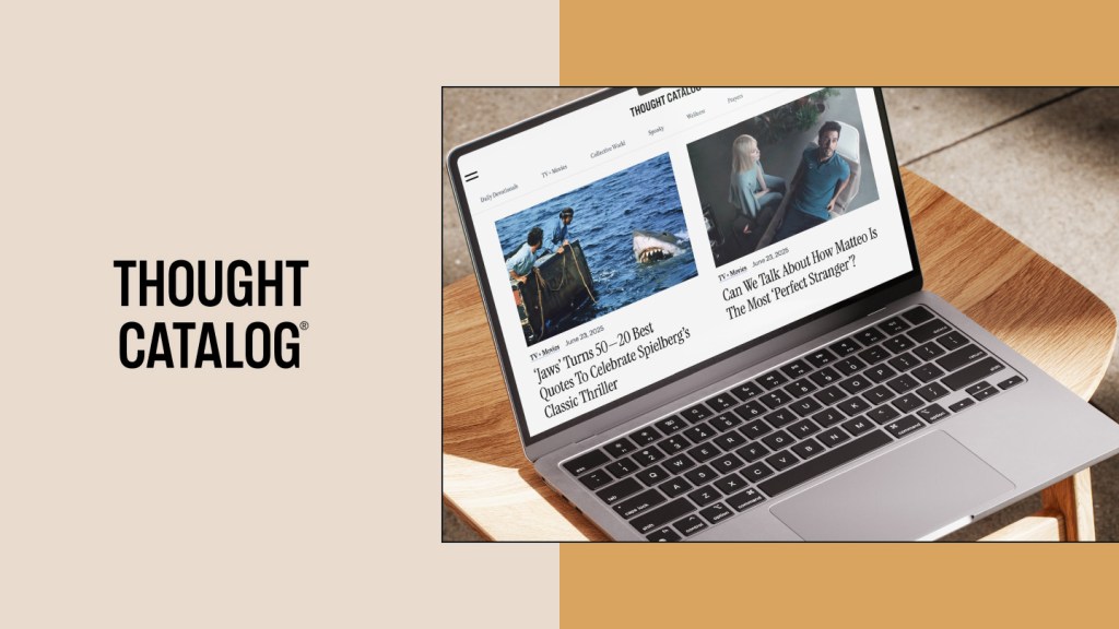 Laptop on wooden chair displaying the Thought Catalog website with featured articles about film and TV. Left side shows the Thought Catalog logo in bold black font on a beige background. Image highlights a modern digital publishing experience on WordPress VIP.