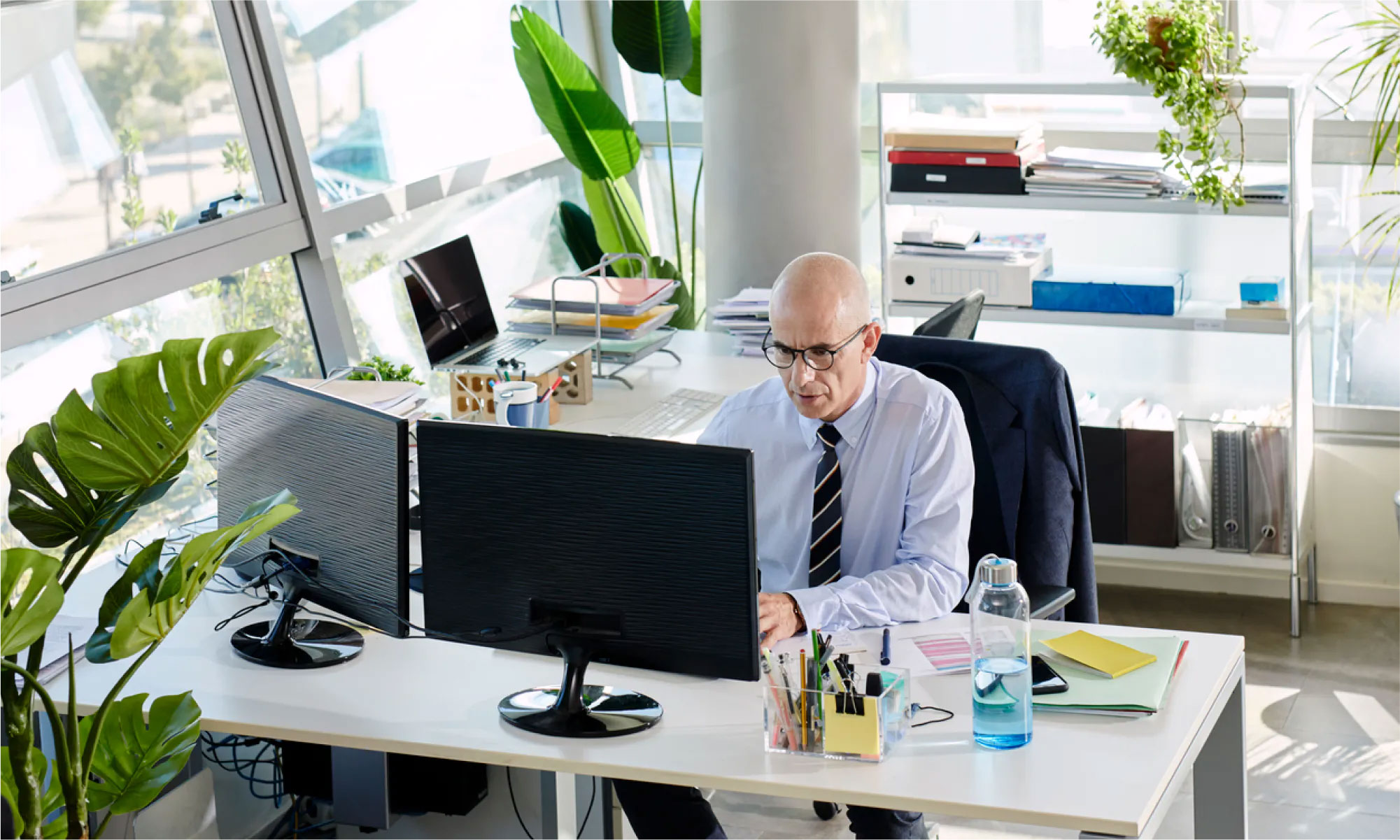 A person working on a computer at a desk